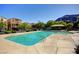 Community pool with lounge area offers a refreshing retreat with mountain views on a clear, sunny day at 3839 Zodiacal Light St, Las Vegas, NV 89129