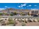 Neighborhood street view showcases beautiful homes and desert landscaping under a bright, sunny sky at 3839 Zodiacal Light St, Las Vegas, NV 89129