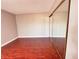 A nice bedroom featuring wood-like floors and a closet with mirrored doors at 4331 Sanderling Cir # 46, Las Vegas, NV 89103