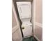 Compact laundry area featuring a stacked washer and dryer, ideal for space-saving convenience at 4331 Sanderling Cir # 46, Las Vegas, NV 89103