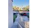 Parking area with carports surrounded by well-manicured greenery and palm trees at 4331 Sanderling Cir # 46, Las Vegas, NV 89103
