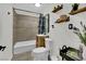 Stylish bathroom with gray tile backsplash, shelving, and modern vanity sink at 4419 Lorna Pl, Las Vegas, NV 89107