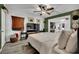 Inviting bedroom with a ceiling fan, TV, and decor for a relaxed atmosphere at 4419 Lorna Pl, Las Vegas, NV 89107