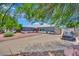 Inviting single-story home with a spacious driveway, mature trees, and a well-maintained front yard at 4419 Lorna Pl, Las Vegas, NV 89107