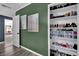 Hallway with wood floors, painted walls, modern art, and closet with storage at 4419 Lorna Pl, Las Vegas, NV 89107