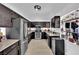 Modern kitchen featuring dark cabinetry, stainless steel appliances, granite countertops, and a wine fridge at 4419 Lorna Pl, Las Vegas, NV 89107