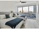 Bright bedroom with two beds, ceiling fan, and a large window offering city views at 4471 Dean Martin Dr # 1109, Las Vegas, NV 89103
