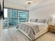 Comfortable bedroom with floor-to-ceiling windows allowing great city views and natural light at 4471 Dean Martin Dr # 1109, Las Vegas, NV 89103
