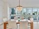This dining room is bright, and features a modern chandelier, and a stunning city view at 4471 Dean Martin Dr # 1109, Las Vegas, NV 89103