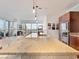 Modern kitchen with a large granite island, pendant lighting, and an open layout for entertaining at 4471 Dean Martin Dr # 1109, Las Vegas, NV 89103