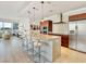 Open concept kitchen with barstool seating and granite counters seamlessly flows into the living area at 4471 Dean Martin Dr # 1109, Las Vegas, NV 89103