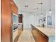 Modern kitchen featuring wood cabinetry, granite countertops, stainless steel appliances, and pendant lighting at 4471 Dean Martin Dr # 1109, Las Vegas, NV 89103