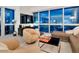 Comfortable living room featuring contemporary furnishings, a large window, and city views at 4471 Dean Martin Dr # 1109, Las Vegas, NV 89103