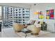 Bright living room featuring floor-to-ceiling windows offering stunning views and comfortable seating arrangements at 4471 Dean Martin Dr # 1109, Las Vegas, NV 89103
