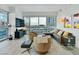 Bright living room featuring floor-to-ceiling windows offering beautiful city views and modern furnishings at 4471 Dean Martin Dr # 1109, Las Vegas, NV 89103