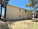 The condo's exterior, featuring a well-maintained lawn and ample space for outdoor activities at 4682 Leeann Ln, Las Vegas, NV 89121
