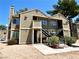 Two-story condo with external stairs, landscaped yard, and modern exterior at 4682 Leeann Ln, Las Vegas, NV 89121