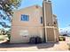 A view of the exterior showing AC units, exterior siding, and well-placed windows for natural light at 4682 Leeann Ln, Las Vegas, NV 89121