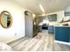Well-lit kitchen boasts stainless steel appliances, stylish cabinets, and attractive flooring at 4682 Leeann Ln, Las Vegas, NV 89121