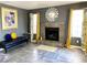 Comfortable living room with a fireplace, tile flooring, and stylish decor at 4682 Leeann Ln, Las Vegas, NV 89121