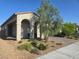 Inviting single-story house with manicured landscaping, desert plants and paver driveway at 4719 N Transcendental St, North Las Vegas, NV 89031