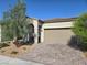 Charming single-story home featuring a desert landscape, brick driveway and a neutral stucco exterior at 4719 N Transcendental St, North Las Vegas, NV 89031