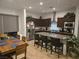Beautiful kitchen with stainless steel appliances, granite countertops, dark cabinets and a breakfast bar at 4719 N Transcendental St, North Las Vegas, NV 89031