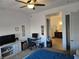 Bright main bedroom with a ceiling fan, plush carpet and en-suite bath at 4719 N Transcendental St, North Las Vegas, NV 89031