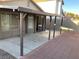 Spacious back patio with covered area and brick-lined concrete, perfect for outdoor entertaining at 5353 Hollow Brook Ave, Las Vegas, NV 89142