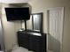 Bedroom featuring a TV, a dresser with mirror, and a white closet door at 5353 Hollow Brook Ave, Las Vegas, NV 89142