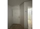 Entryway with tiled flooring and a white front door and a view down the hallway at 5353 Hollow Brook Ave, Las Vegas, NV 89142
