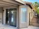 Cozy covered patio featuring a sliding glass door and textured stucco exterior at 5353 Hollow Brook Ave, Las Vegas, NV 89142