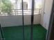 Exterior view of a balcony with synthetic grass and a view of the complex at 5655 E Sahara Ave # 2068, Las Vegas, NV 89142