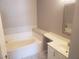 Bright bathroom featuring a tub and vanity at 5655 E Sahara Ave # 2068, Las Vegas, NV 89142