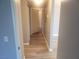 Hallway leading to other rooms of the home with new flooring at 5655 E Sahara Ave # 2068, Las Vegas, NV 89142