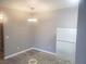 Eat-in kitchen area with granite countertops, white appliances, and updated flooring at 5655 E Sahara Ave # 2068, Las Vegas, NV 89142