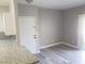Bright living room featuring new gray flooring and neutral wall color at 5655 E Sahara Ave # 2068, Las Vegas, NV 89142