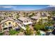 Lush backyard with a covered patio, well-kept lawn, mature palm trees, and a pool at 5712 French Lace Ct, North Las Vegas, NV 89081