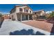 Backyard showing a covered patio area, trampoline, and hardscape with desert landscaping at 5712 French Lace Ct, North Las Vegas, NV 89081