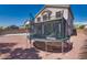 Backyard featuring a trampoline and ample space for outdoor activities, with a privacy wall and a view of the house at 5712 French Lace Ct, North Las Vegas, NV 89081