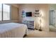 Bedroom featuring a modern dresser with a television and stylish floor lamp at 5712 French Lace Ct, North Las Vegas, NV 89081