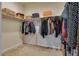 Walk-in closet with ample hanging space and shelving, ideal for organizing clothes and accessories at 5712 French Lace Ct, North Las Vegas, NV 89081
