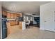 Bright kitchen area with an island, seating, and seamlessly connects to a cozy living space at 5712 French Lace Ct, North Las Vegas, NV 89081