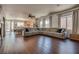 Expansive living room with ample seating, natural light, and a view into the kitchen area at 5712 French Lace Ct, North Las Vegas, NV 89081