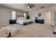 Expansive main bedroom featuring a king-sized bed, large windows, and neutral color scheme at 5712 French Lace Ct, North Las Vegas, NV 89081