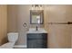 Bathroom with a vanity, mirror, lighting and commode at 5816 Glory Canyon Way, Las Vegas, NV 89142