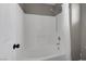 Bright bathroom with a white tiled shower and tub combination at 5816 Glory Canyon Way, Las Vegas, NV 89142