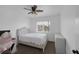 Comfortable bedroom with a window providing natural light and a ceiling fan at 5816 Glory Canyon Way, Las Vegas, NV 89142