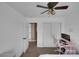 Bedroom featuring a ceiling fan, closet, and a neutral color scheme at 5816 Glory Canyon Way, Las Vegas, NV 89142