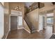 Entryway featuring high ceilings, hardwood-style floors, staircase, and neutral color walls at 5816 Glory Canyon Way, Las Vegas, NV 89142